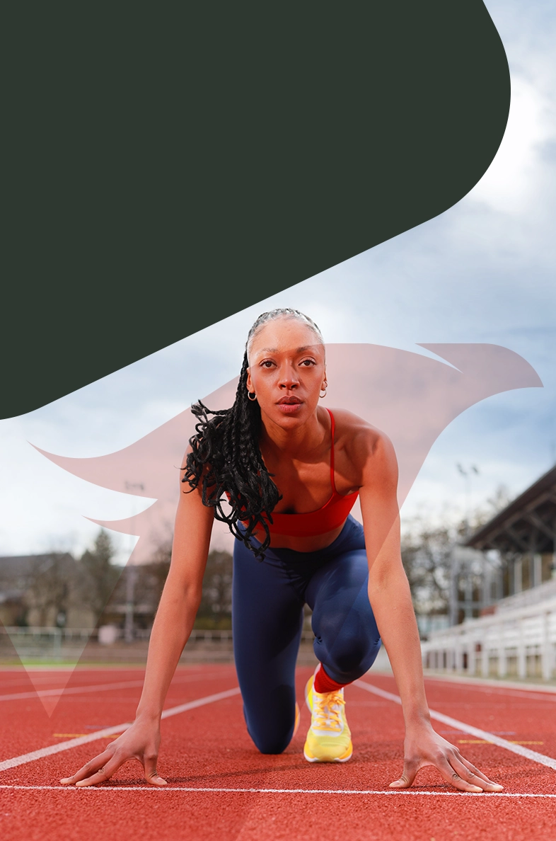 Athletin in Startposition auf der Laufbahn – FOREVER YOUNG Newsletter & WhatsApp